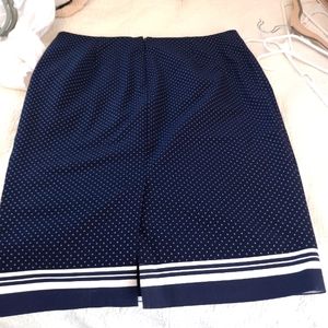 New York and Co. navy blue with small white polka dot skirt.